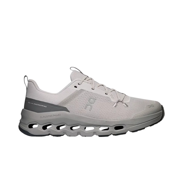 A light gray and white On running shoe with a distinctive cloud-like sole, shown in a side profile on a light gray background.