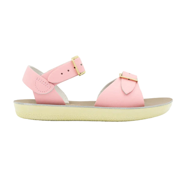 Sun San pink sandal with a yellow sole on a light gray background