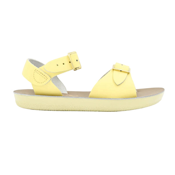Sun San yellow sandal with a strap on a light gray background